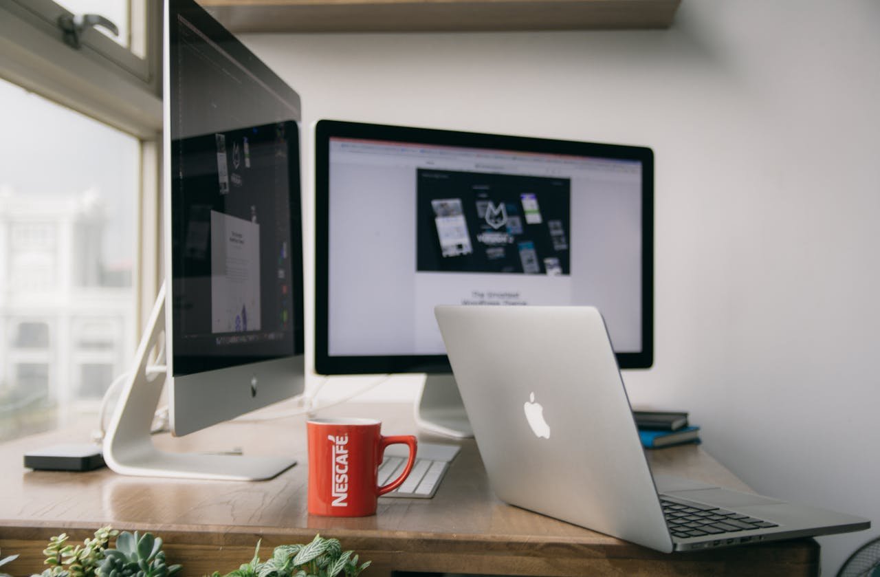 A modern responsive website layout showing clean typographic hierarchy and optimized interface design on laptop and smartphone viewports.